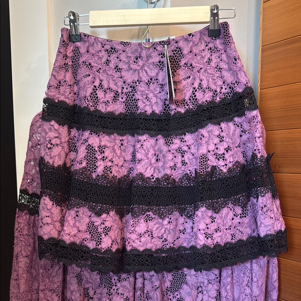ALEXIS Brunna Skirt XS NWT
Lace mini Skirt in Purple and Black